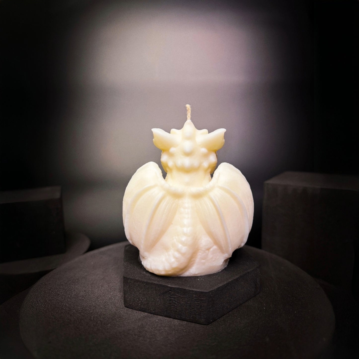 Back view of handmade dragon candle with wings, 100% soy wax fantasy decor from Norway.