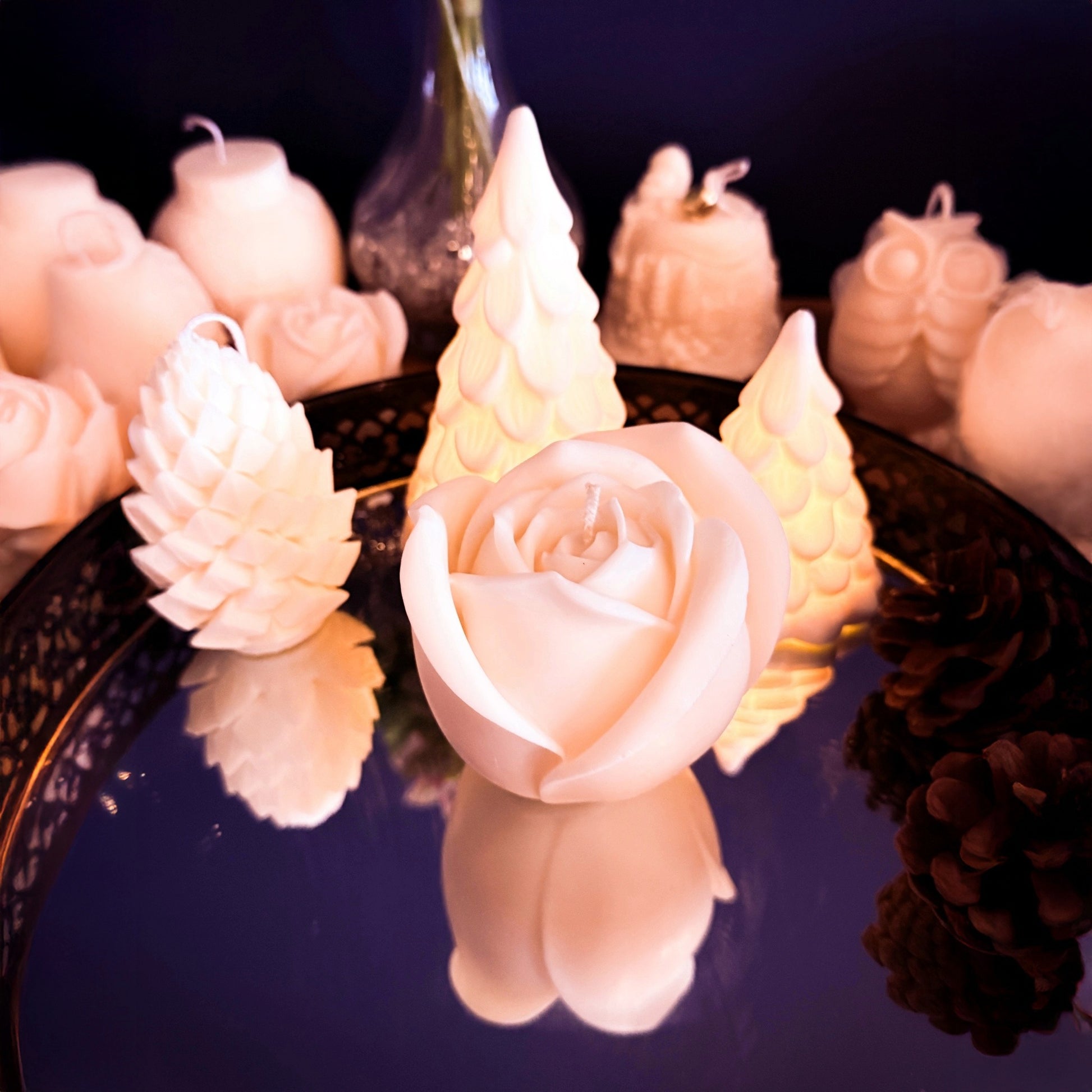 Top view of a handmade large rose-shaped soy wax candle, detailed petal structure and floral sculptural design, decorative candle for elegant interior styling.