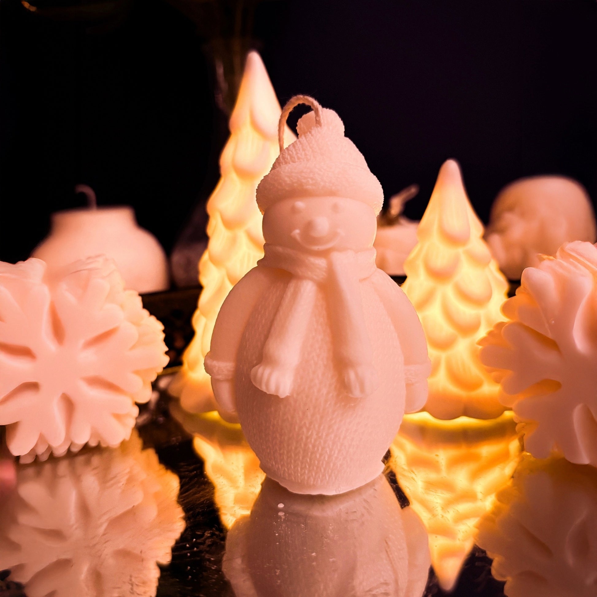 Handmade large snowman candle made from natural soy wax, wearing winter clothes with hat and scarf, cozy Christmas decorative candle for festive home decor.