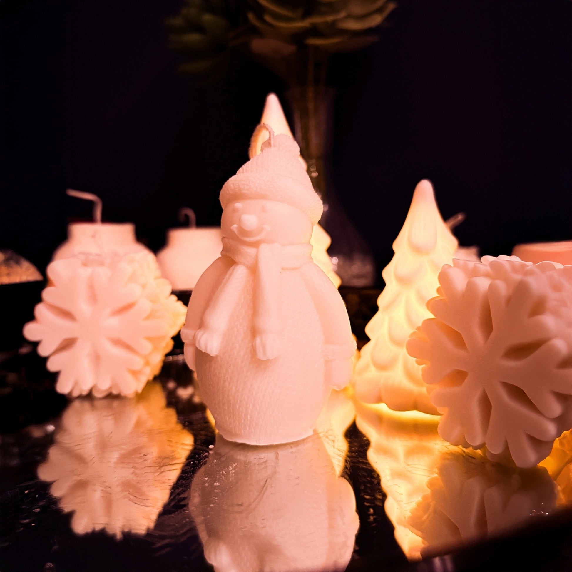 Handcrafted large snowman candle in natural soy wax, right side view showing sculpted winter outfit, decorative Christmas candle for cozy seasonal styling.