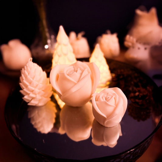 Top view of a handmade rose candle set in natural soy wax, showcasing detailed sculpted petals on large and small rose candles, decorative floral candle set for interior styling.