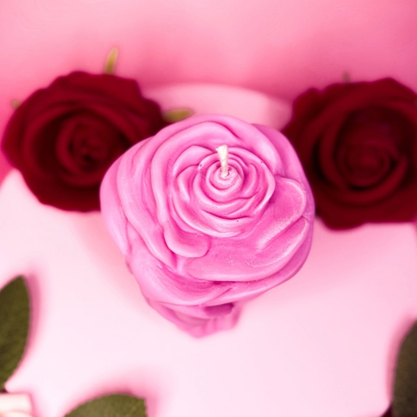 Romantic pink rose candle made from natural soy wax.