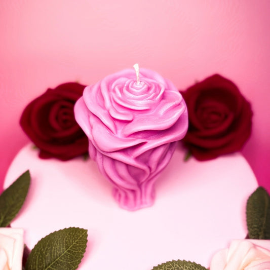 Pink handmade rose candle in soy wax styled for Valentine’s Day.