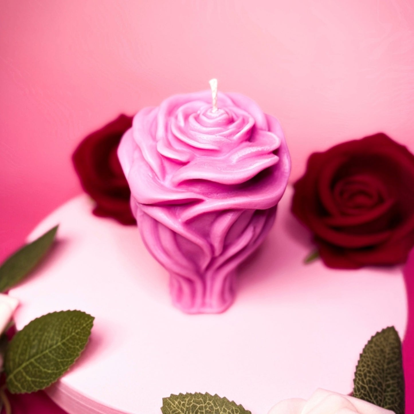 Decorative rose-shaped soy wax candle with detailed petals.