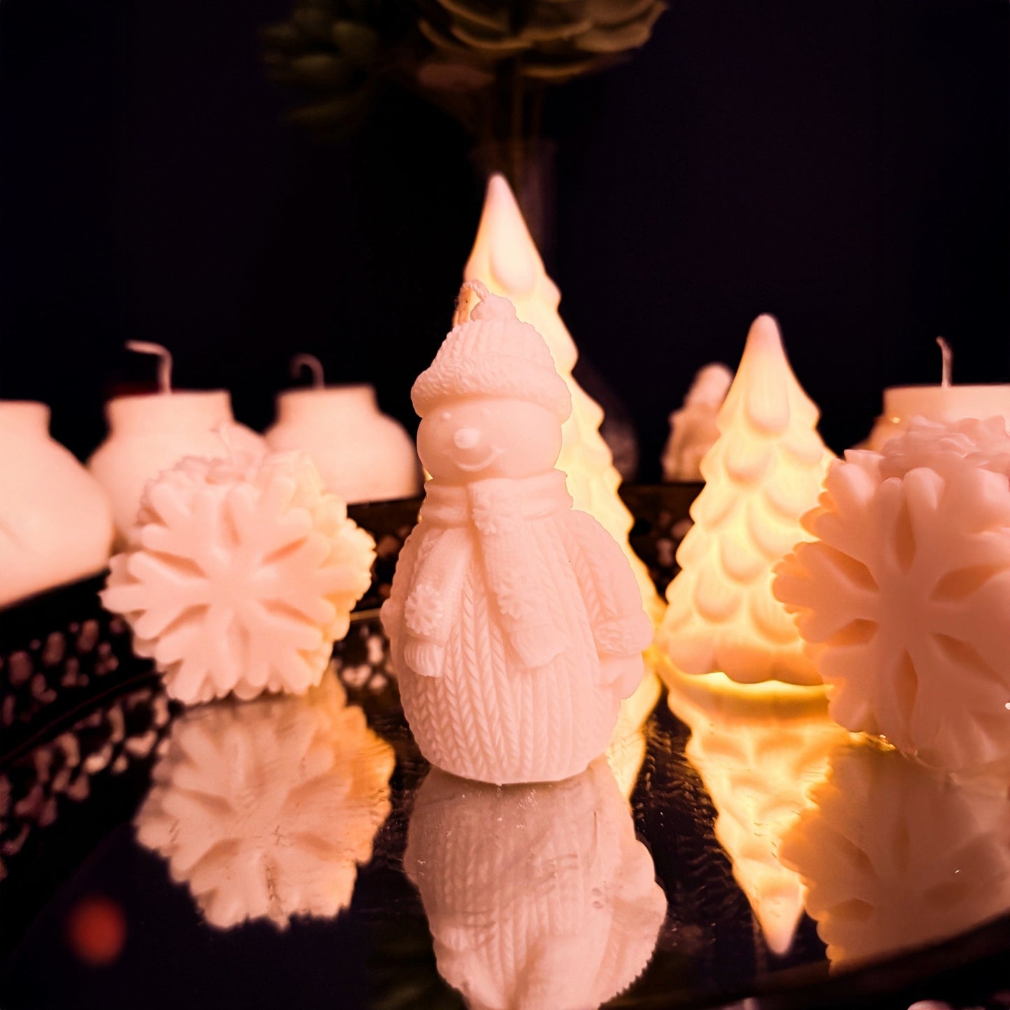 Handcrafted snowman candle in natural soy wax, right side view showing textured winter outfit, decorative Christmas candle for cozy seasonal interiors.