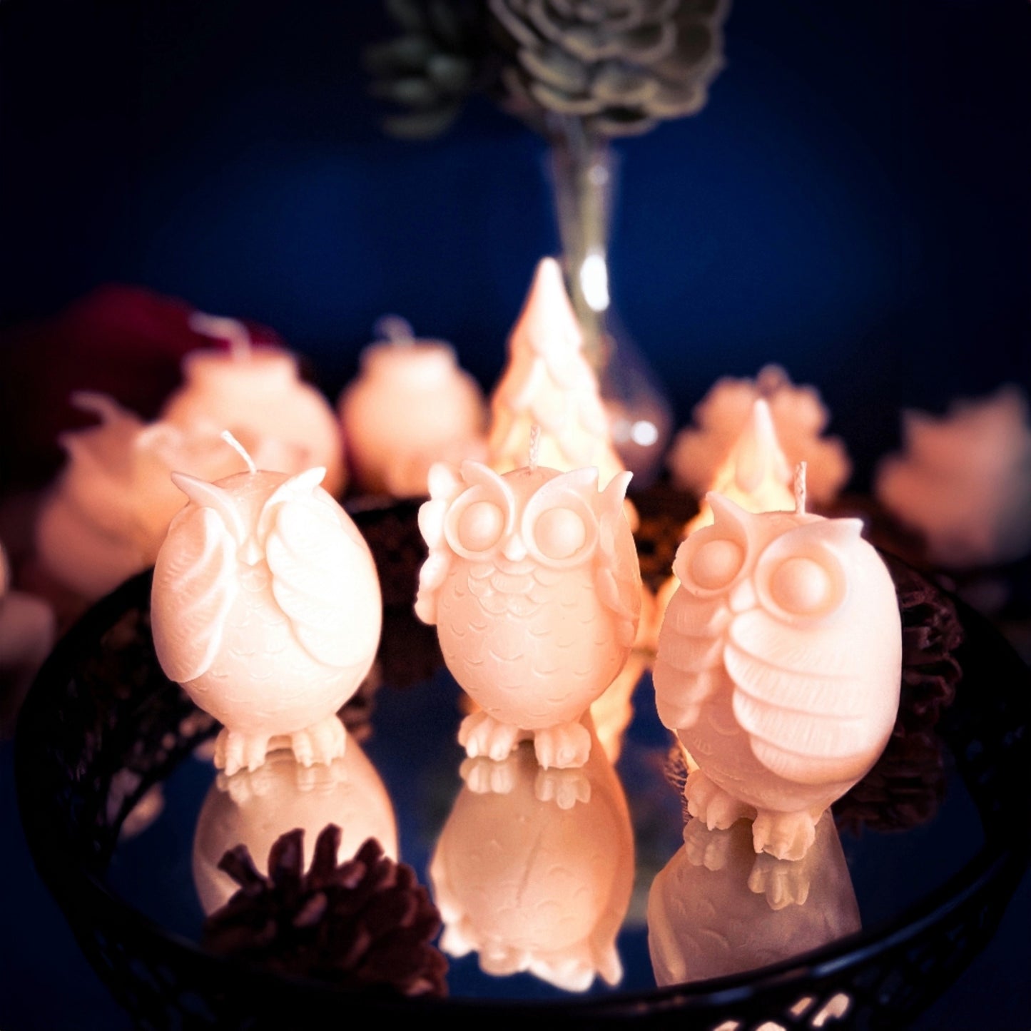 Decorative owl trio candles in natural soy wax, small handcrafted owl figures styled together with soft warm background light.