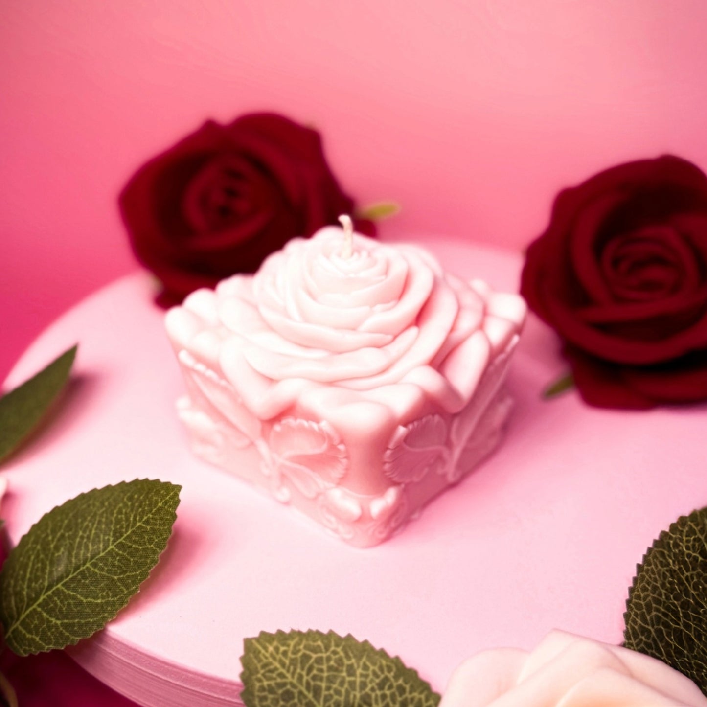Close-up of handmade rose gift candle, floral decorative soy wax candle