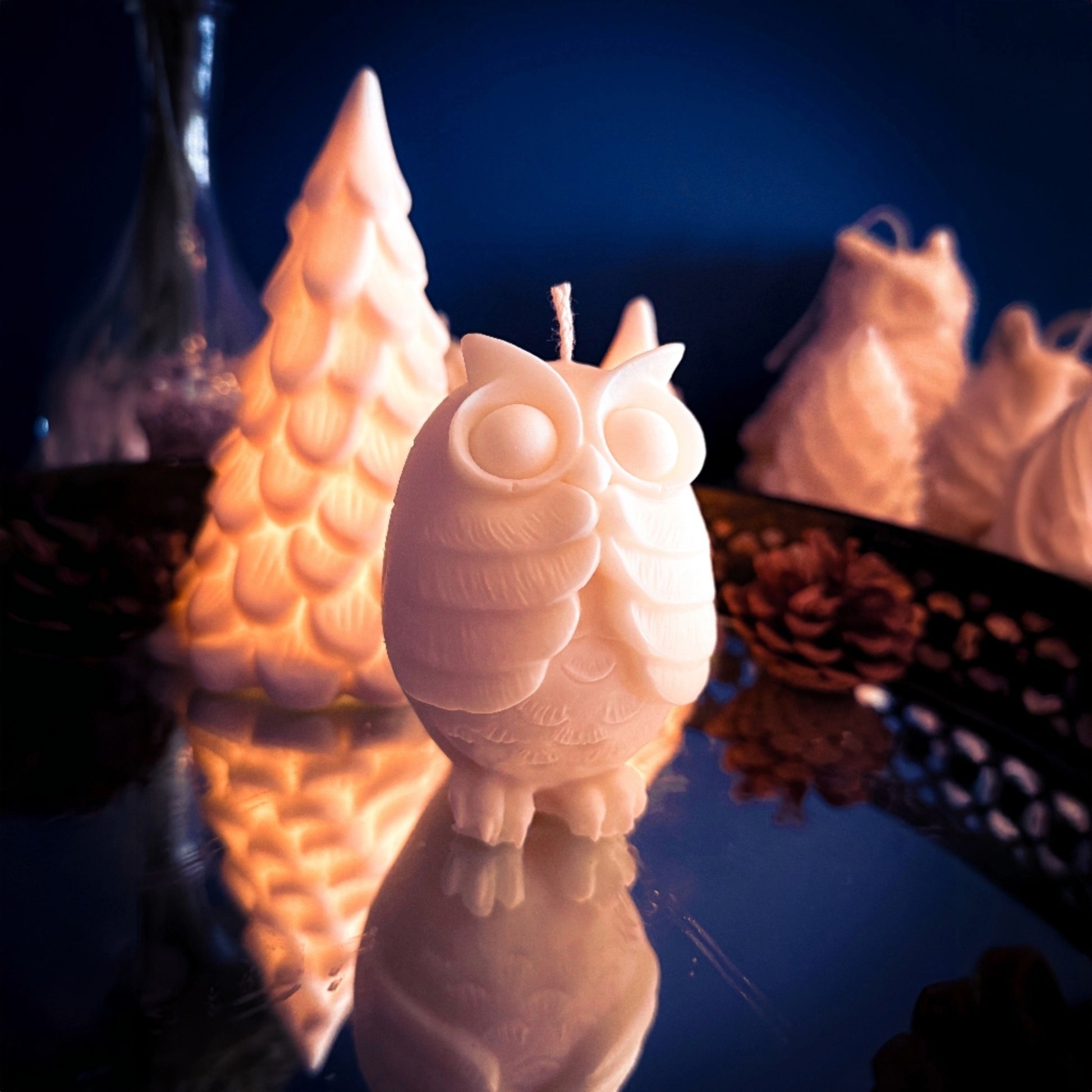 Side view of The Shocked Owl soy wax candle with detailed feathers and wide eyes.